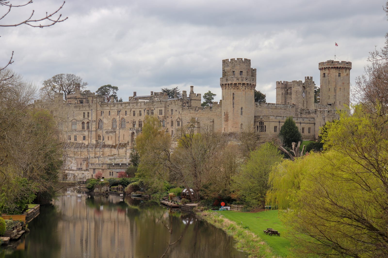 The towers and battlements of Warwick Castle above the River Avon