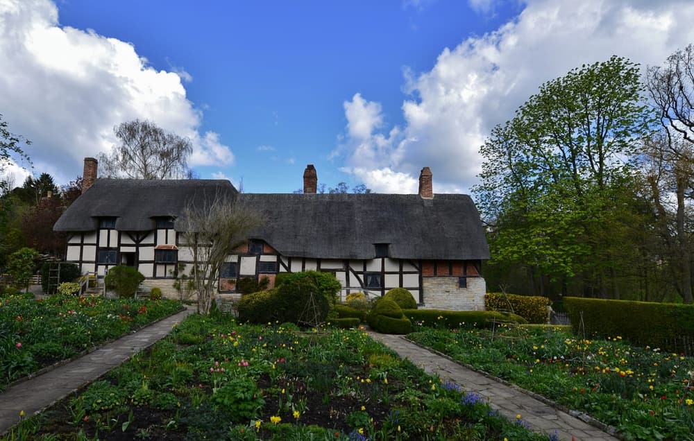 The thatched roof and cottage garden of Anne Hathaway's Cottage in Shottery