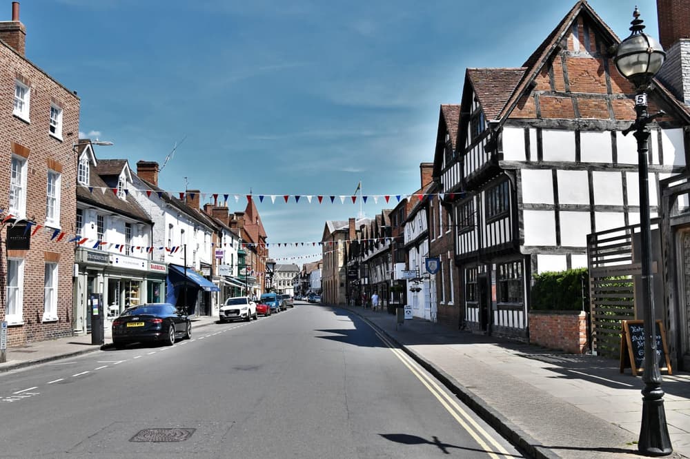 A narrow Tudor lane in Stratford-upon-Avon at dusk